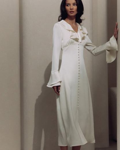 Vestido midi con volantes y botones de perla