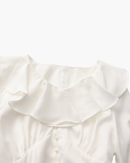 Vestido midi con volantes y botones de perla