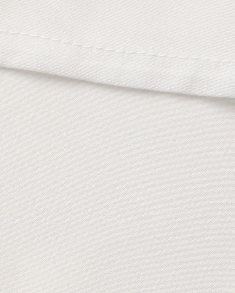 Vestido midi con volantes y botones de perla